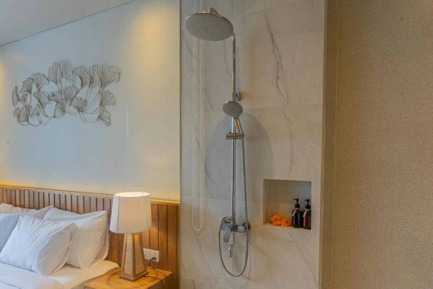 Woven bamboo pendant lights hanging in a modern tropical room with gray curtains, wooden shelves, and infinity pool view. - Bali Villas