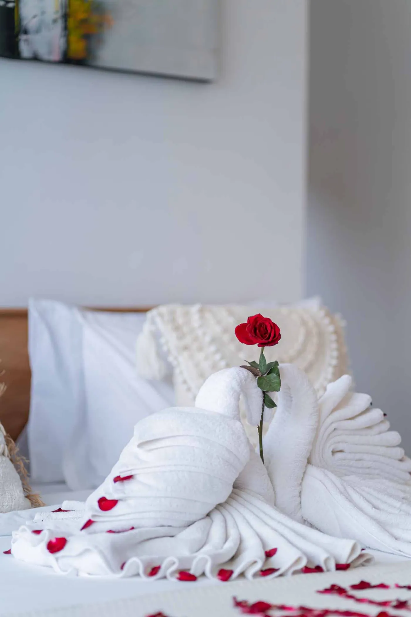 Modern minimalist interior with wooden desk, potted cactus in round window, rattan lamp, and tiled flooring. - Bali Villas
