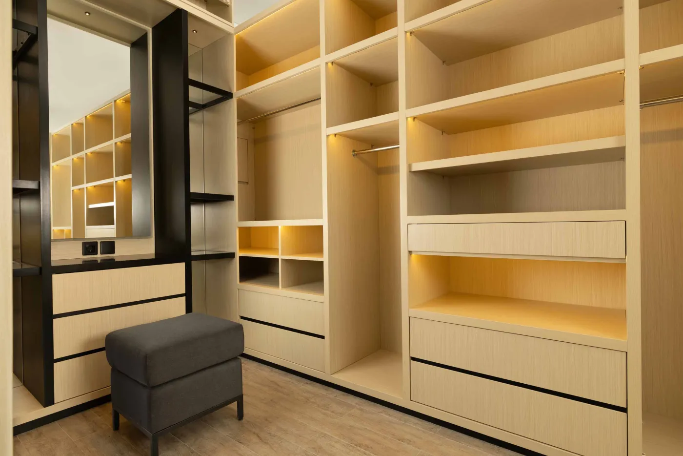 Modern luxury bathroom with freestanding bathtub, walk-in rain shower, wooden accents, and bedroom view. - Bali Villas