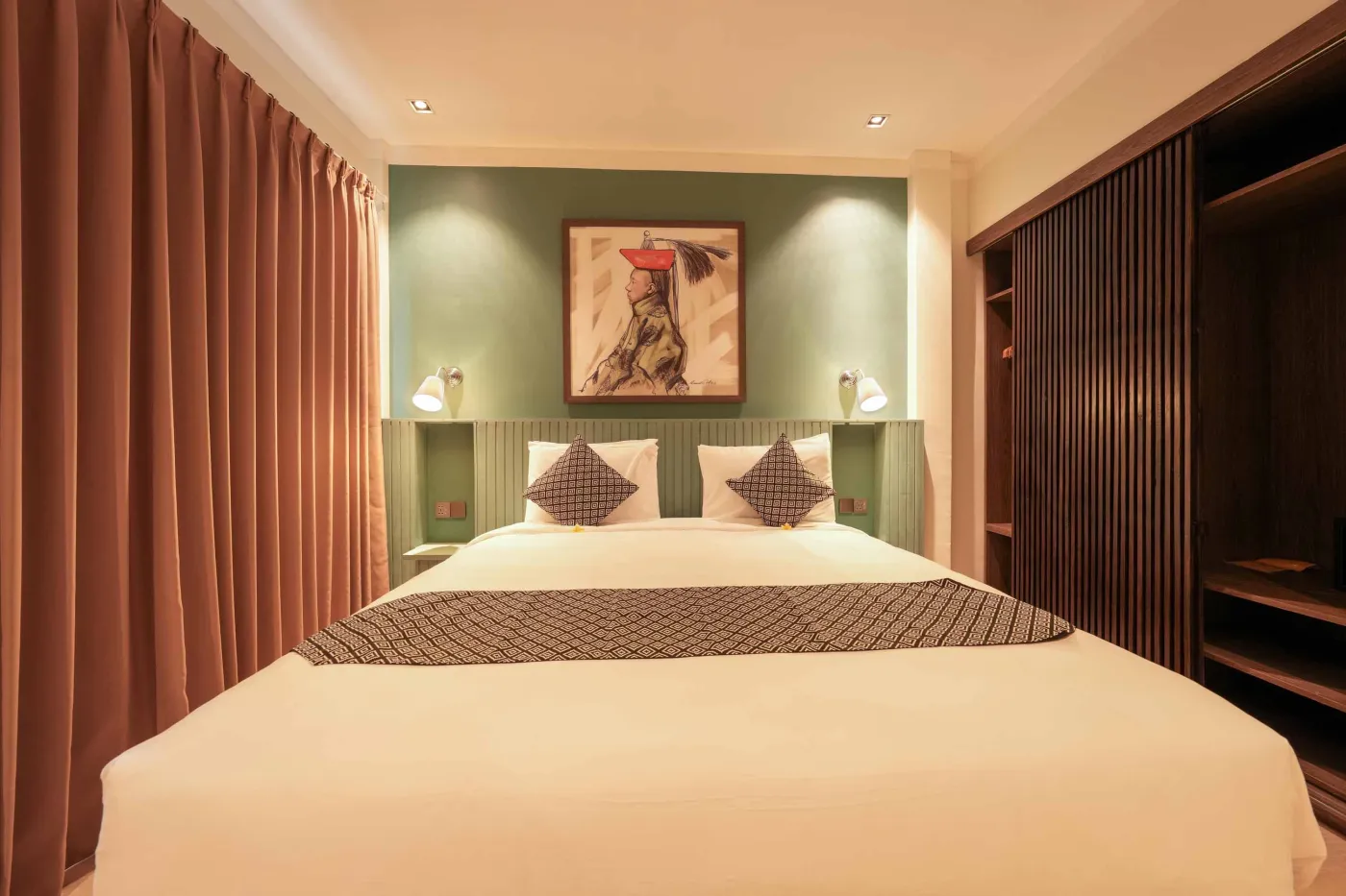 Modern wooden kitchen with stainless steel sink, refrigerator, microwave, cooktop, and warm LED lighting. - Bali Villas