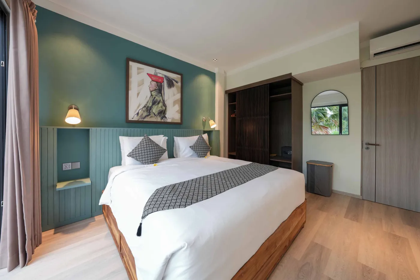 Modern wooden kitchen with stainless steel sink, refrigerator, microwave, cooktop, and warm LED lighting. - Bali Villas