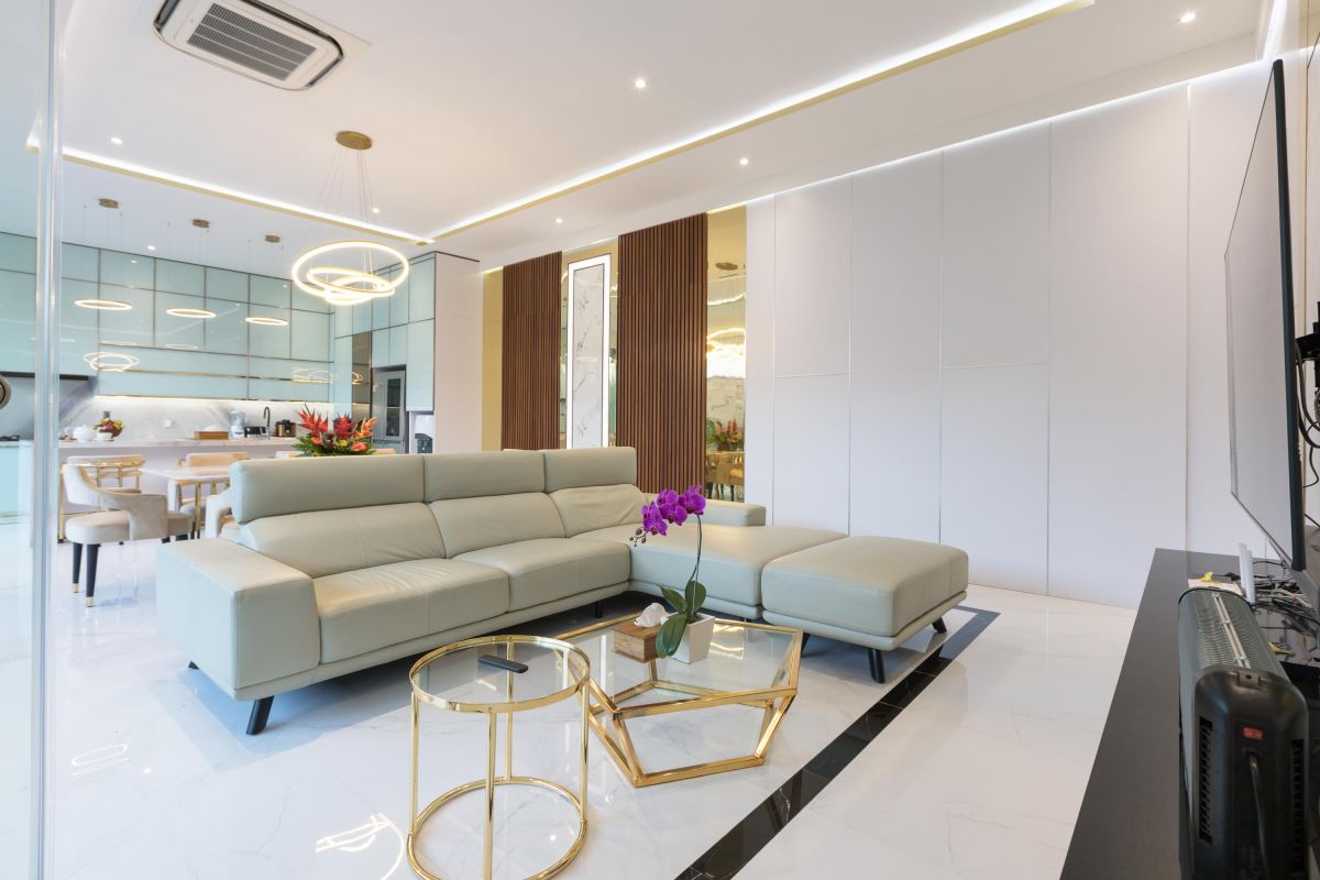 Modern luxury kitchen with glossy turquoise cabinets, marble counters, built-in appliances, and pendant lighting. - Bali Villas