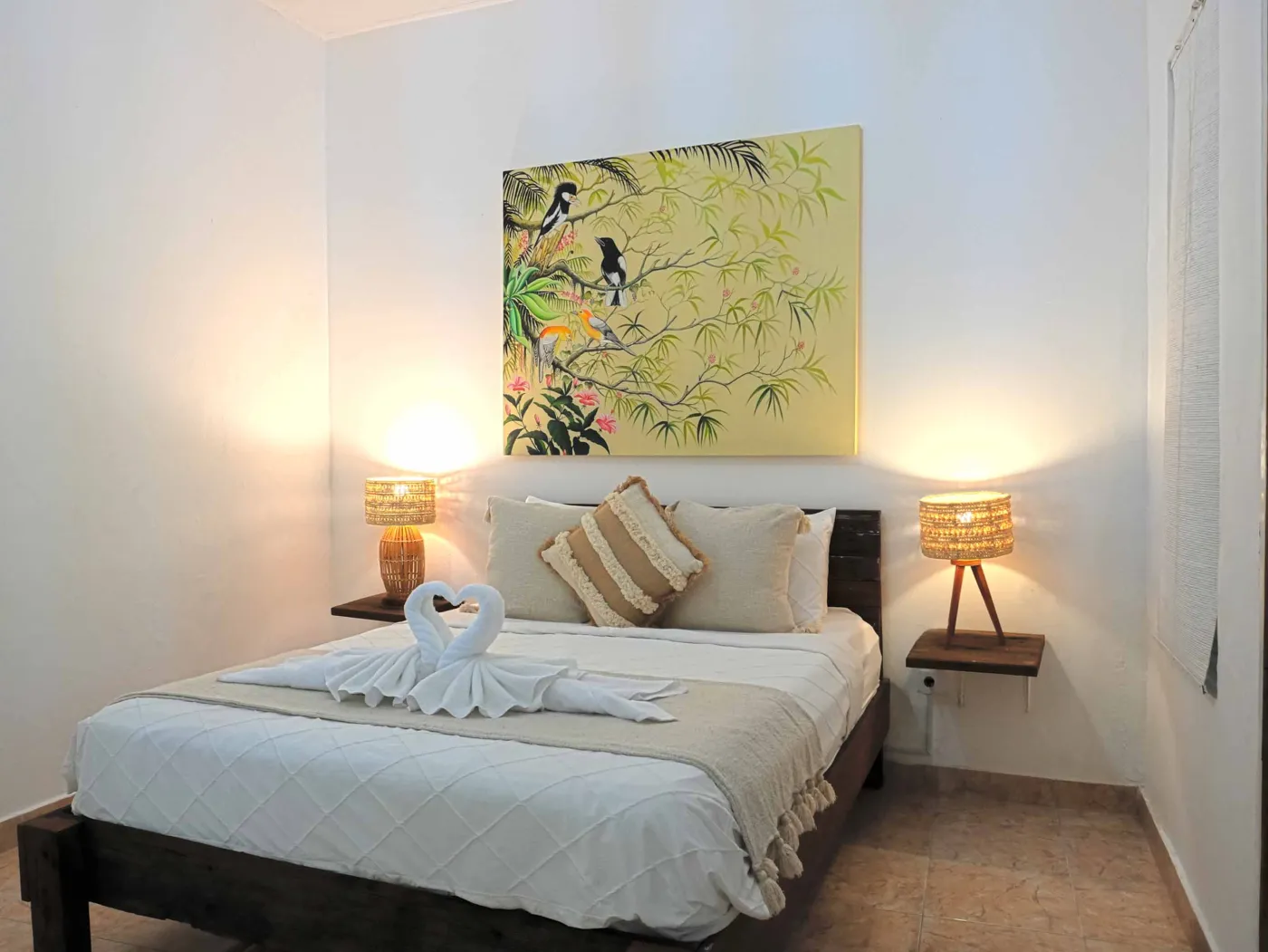 Modern bathroom with glass shower enclosure, rain showerhead, and wooden vanity sink. - Bali Villas